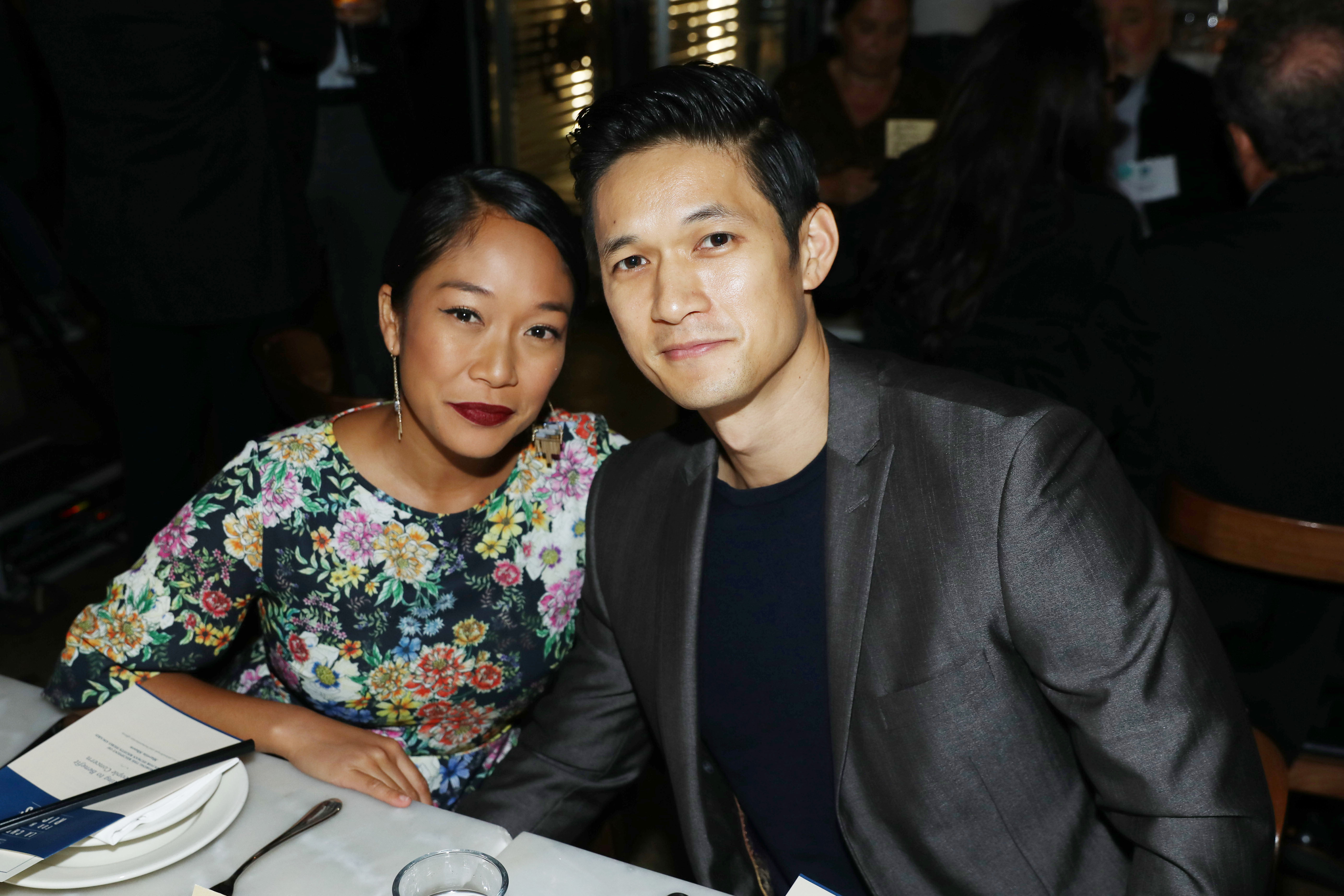 Shelby Rabara and Harry Shum Jr at a table during the 2018 LA Chefs for Human Rights Gala
